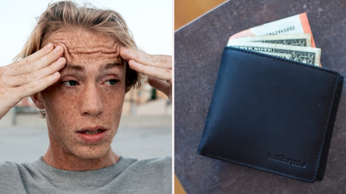 Panicked teen with blonde hair and freckles looking worried at a wallet with money