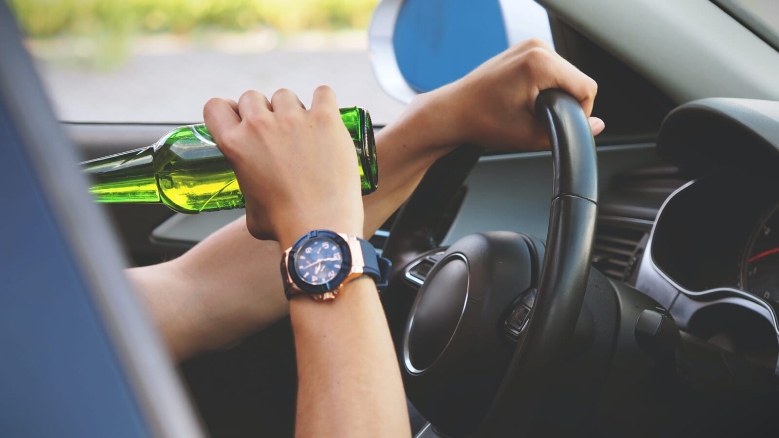 person drinking and driving